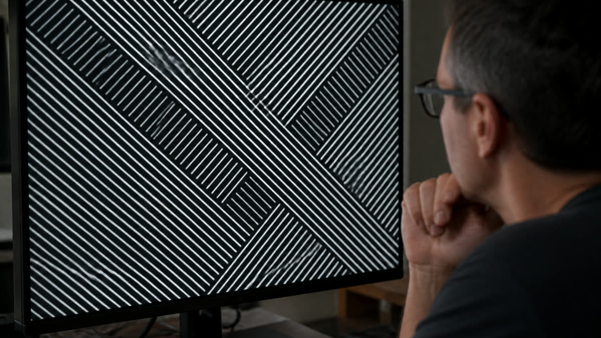 A computer monitor showing a diagonal crosshatch with bright white sharpening halos around every line.